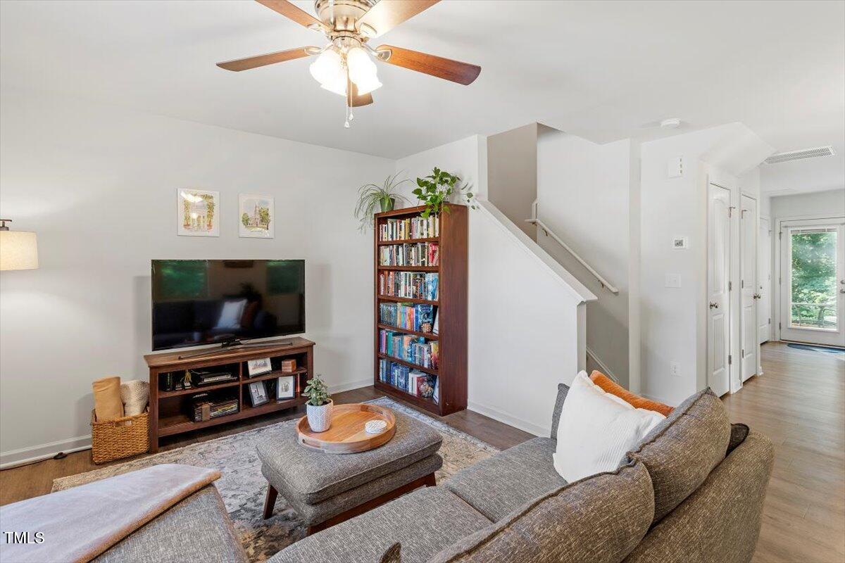 534 Hobkirks Place Durham, NC 27704 - Photo 6 of 34 a living room with furniture and a flat screen tv