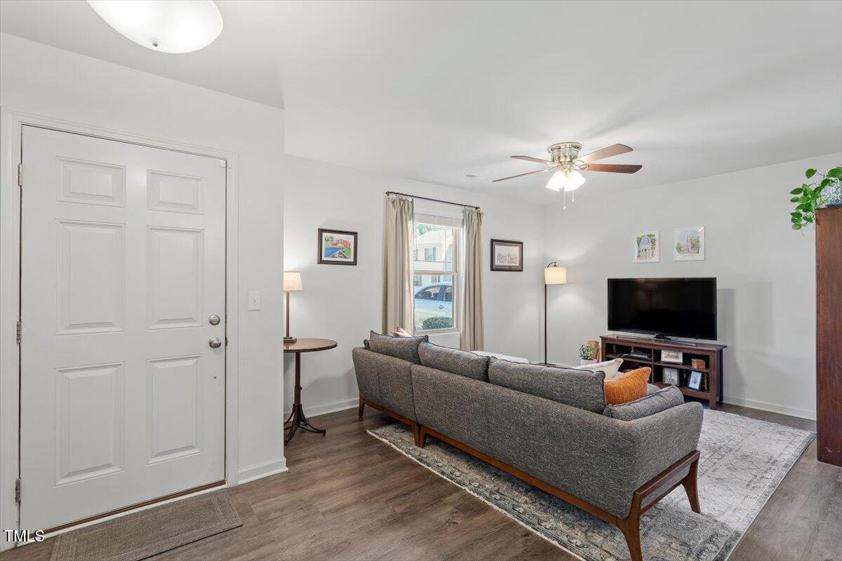 534 Hobkirks Place Durham, NC 27704 - Photo 8 of 34 a living room with furniture and a flat screen tv