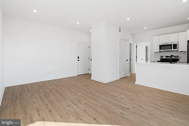 a view of a kitchen with wooden floor