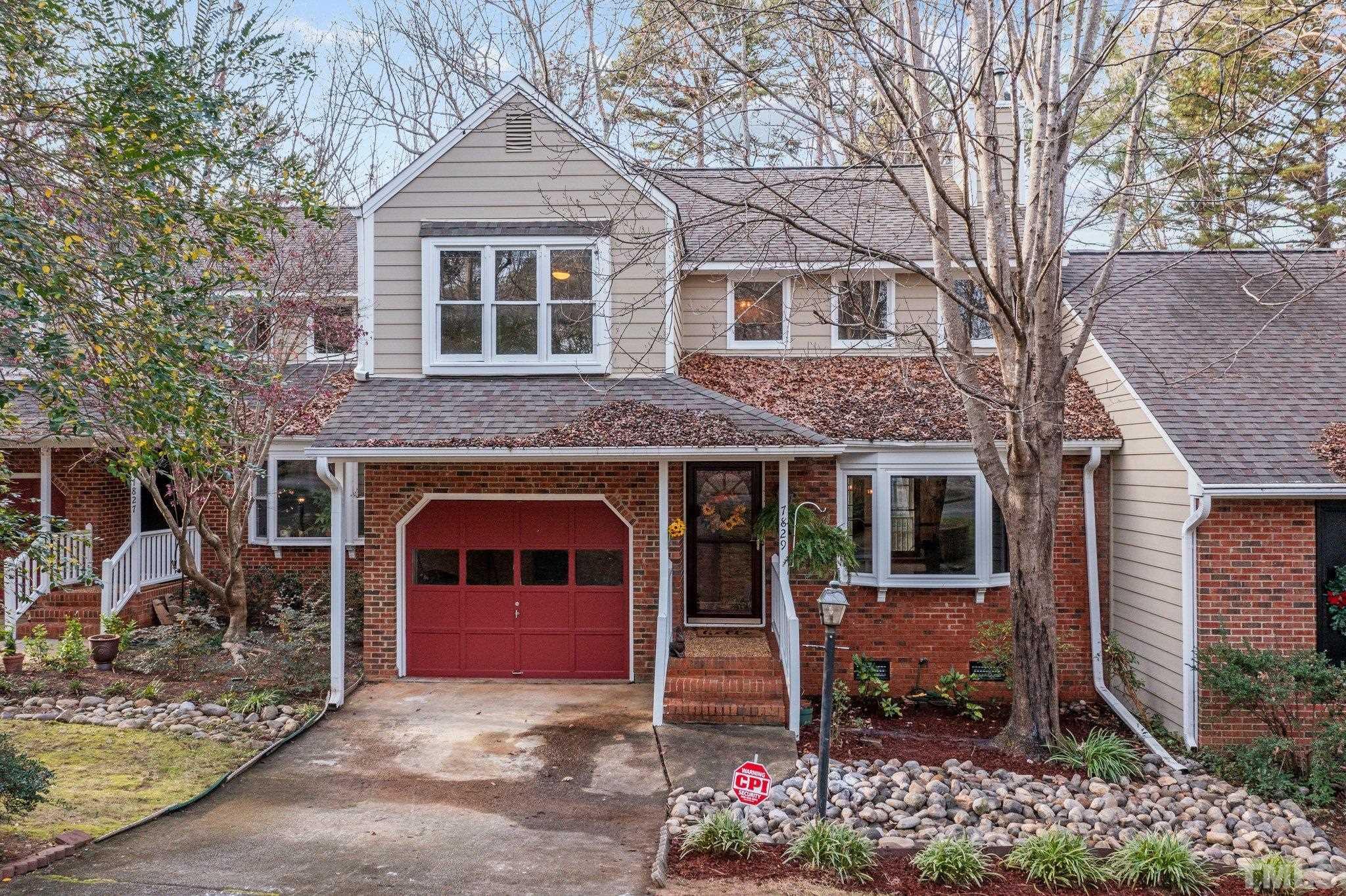 7829 Breckon Way Raleigh, NC 27615 - Photo 1 of 40 a front view of a house with a yard