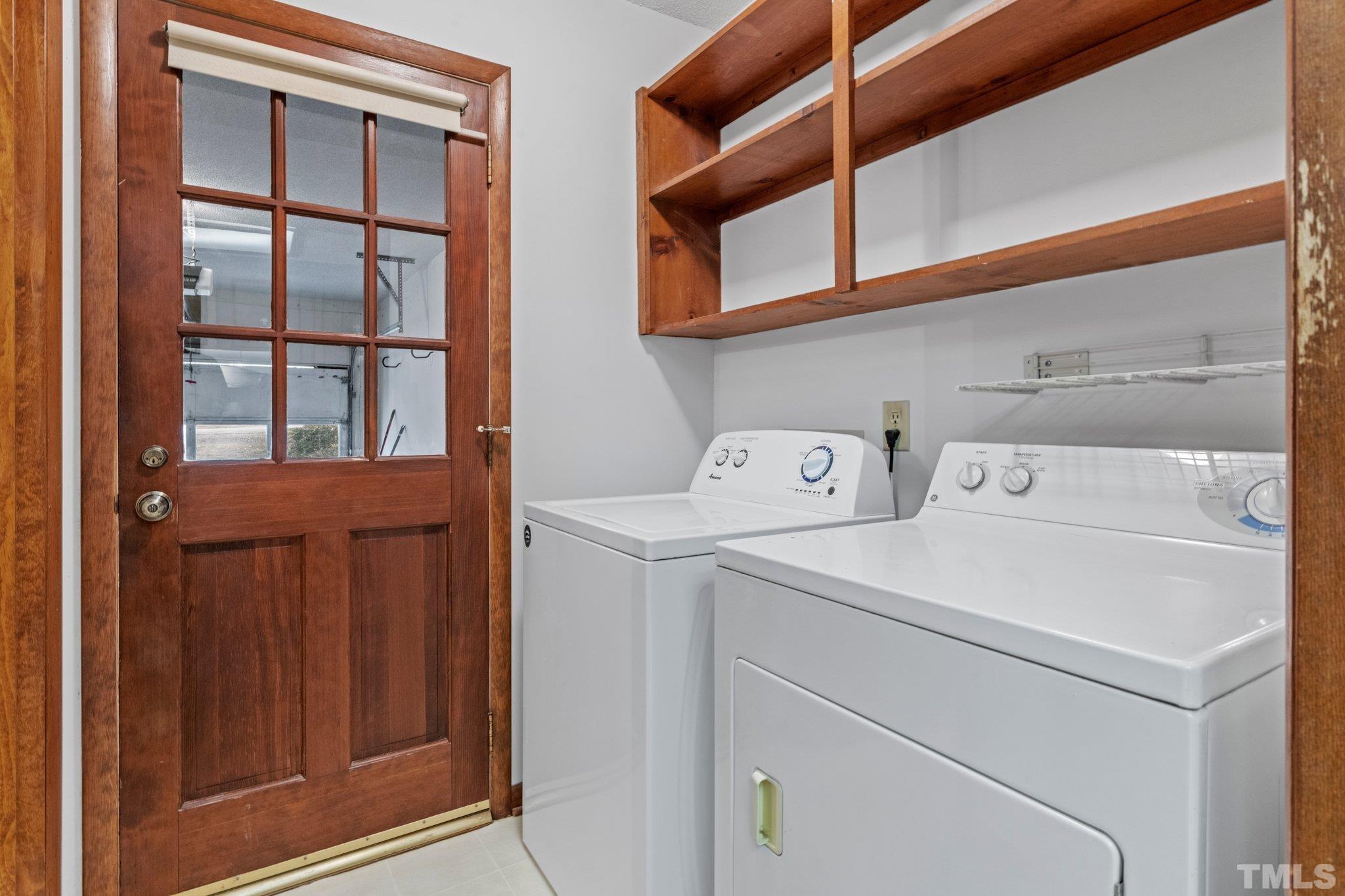 7829 Breckon Way Raleigh, NC 27615 - Photo 13 of 40 a utility room with dryer and washer