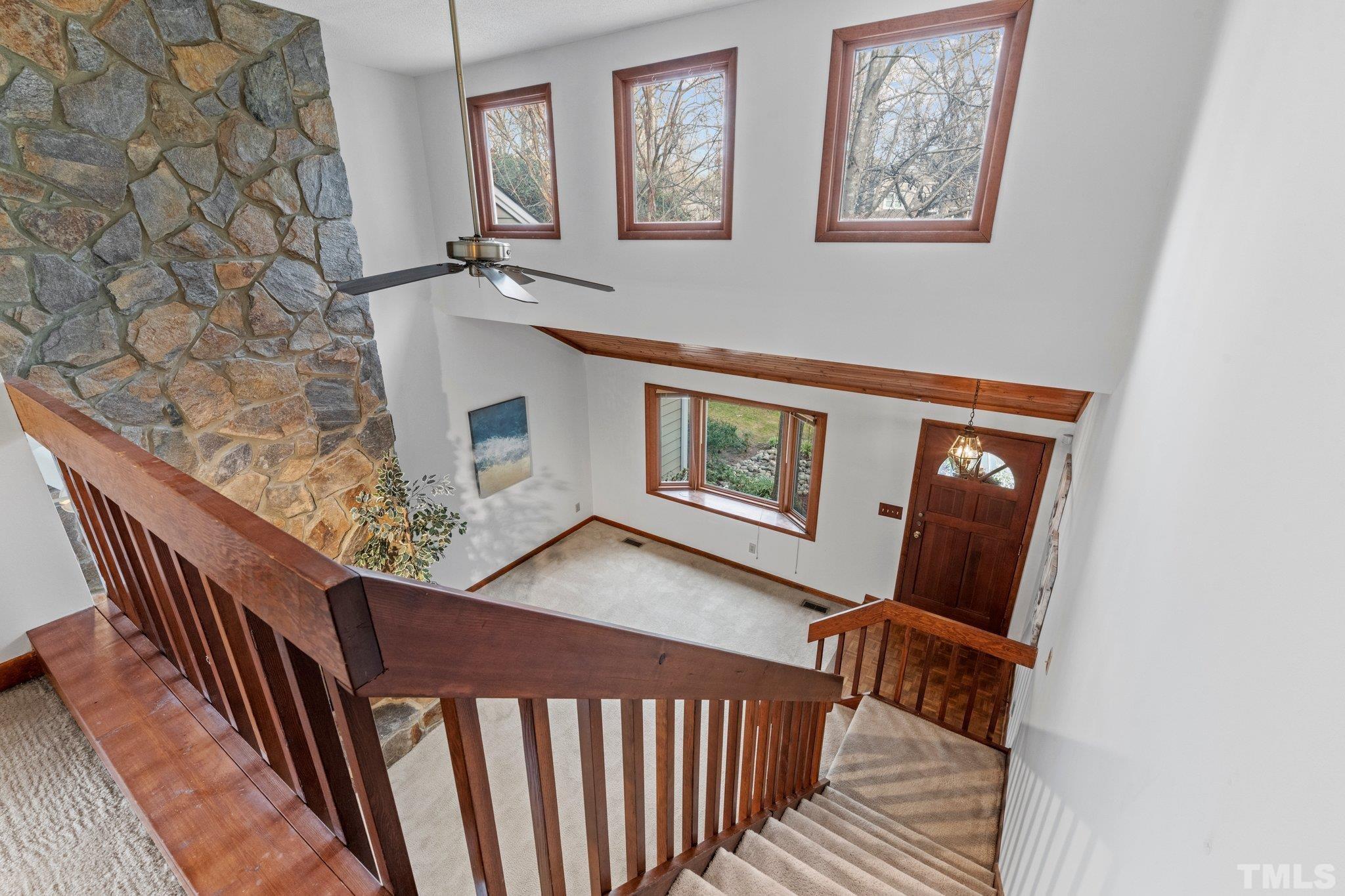 7829 Breckon Way Raleigh, NC 27615 - Photo 15 of 40 a view of a balcony with furniture and wooden floor
