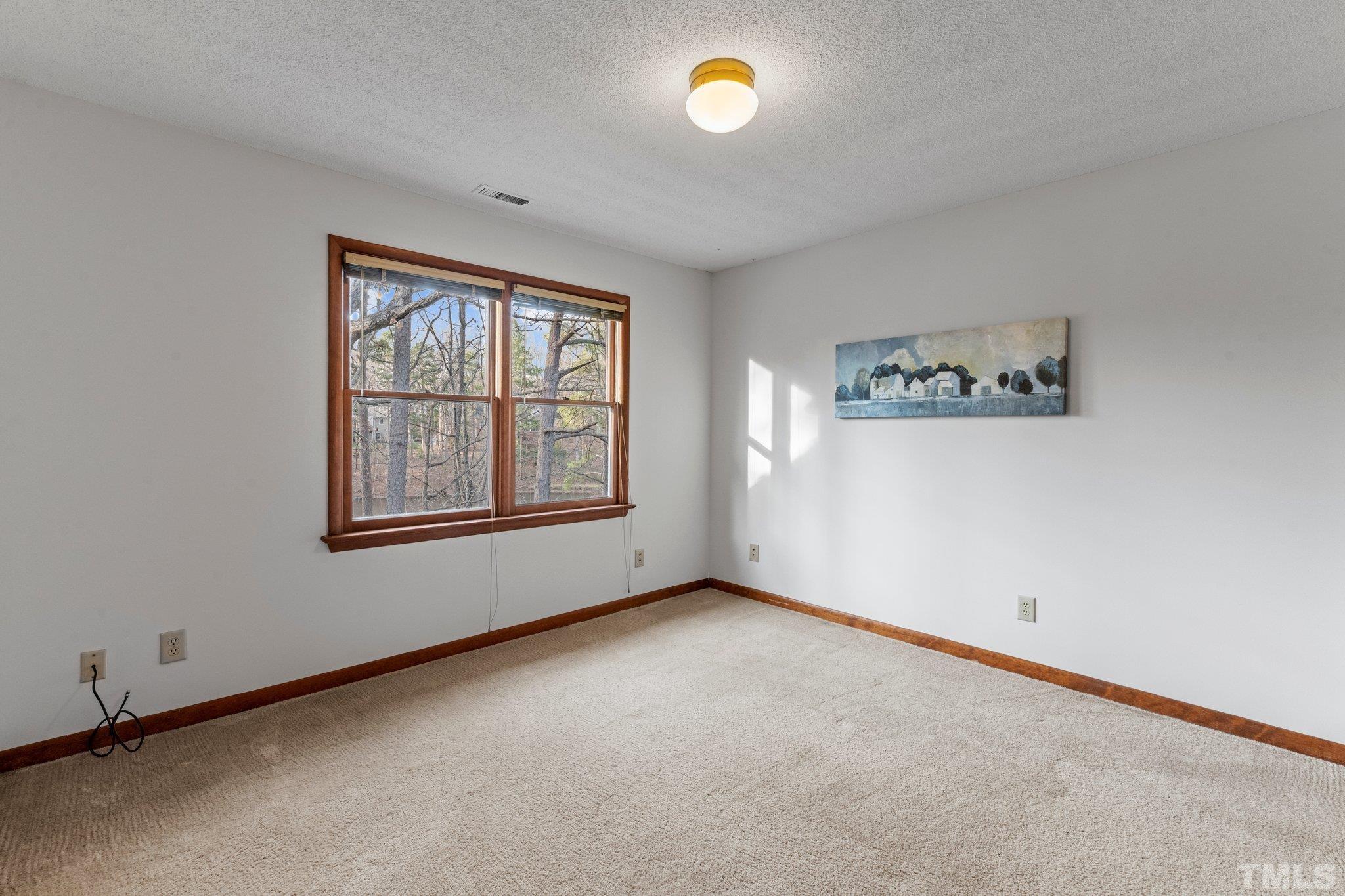 7829 Breckon Way Raleigh, NC 27615 - Photo 21 of 40 an empty room with windows