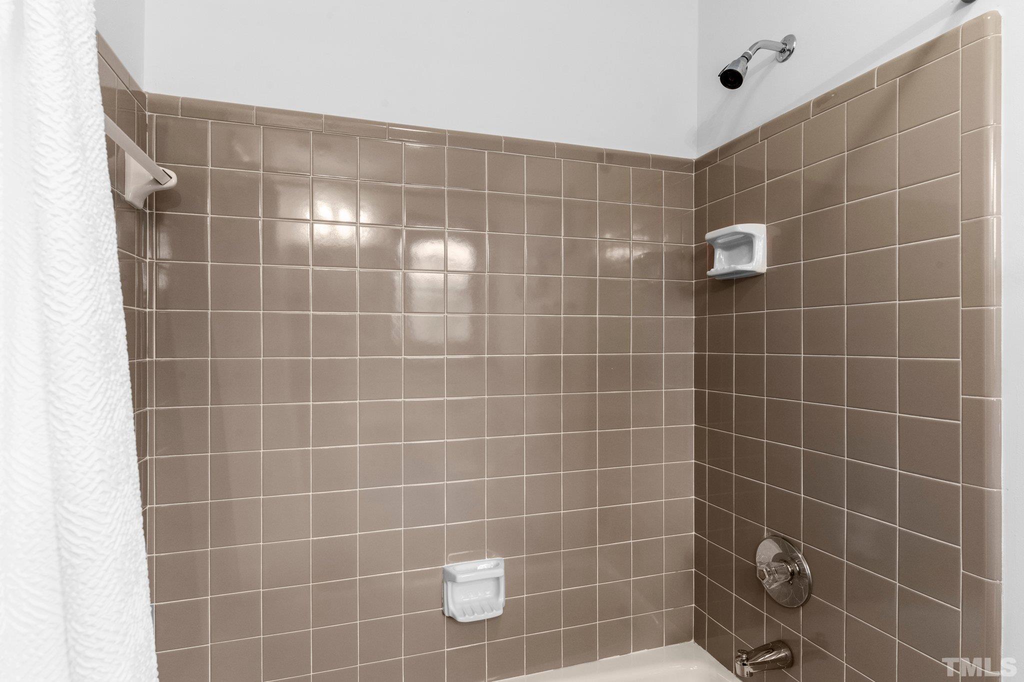 7829 Breckon Way Raleigh, NC 27615 - Photo 23 of 40 a bathroom with a shower