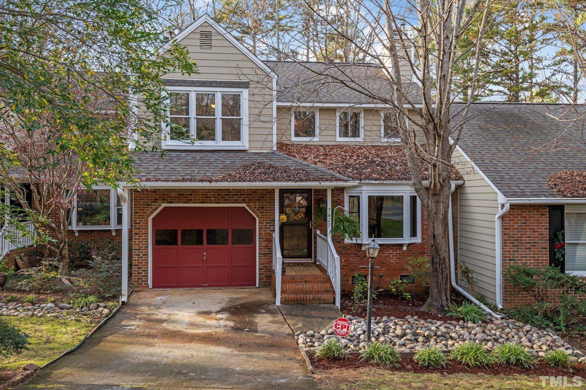 7829 Breckon Way Raleigh, NC 27615 - Photo 39 of 40 a front view of a house with a garden