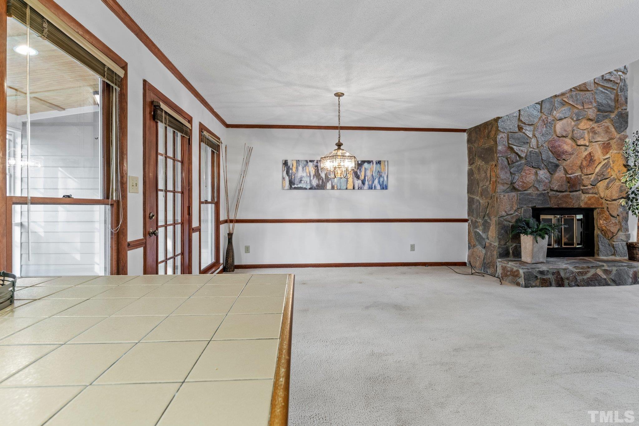 7829 Breckon Way Raleigh, NC 27615 - Photo 9 of 40 a view of a windows and a fireplace in a room