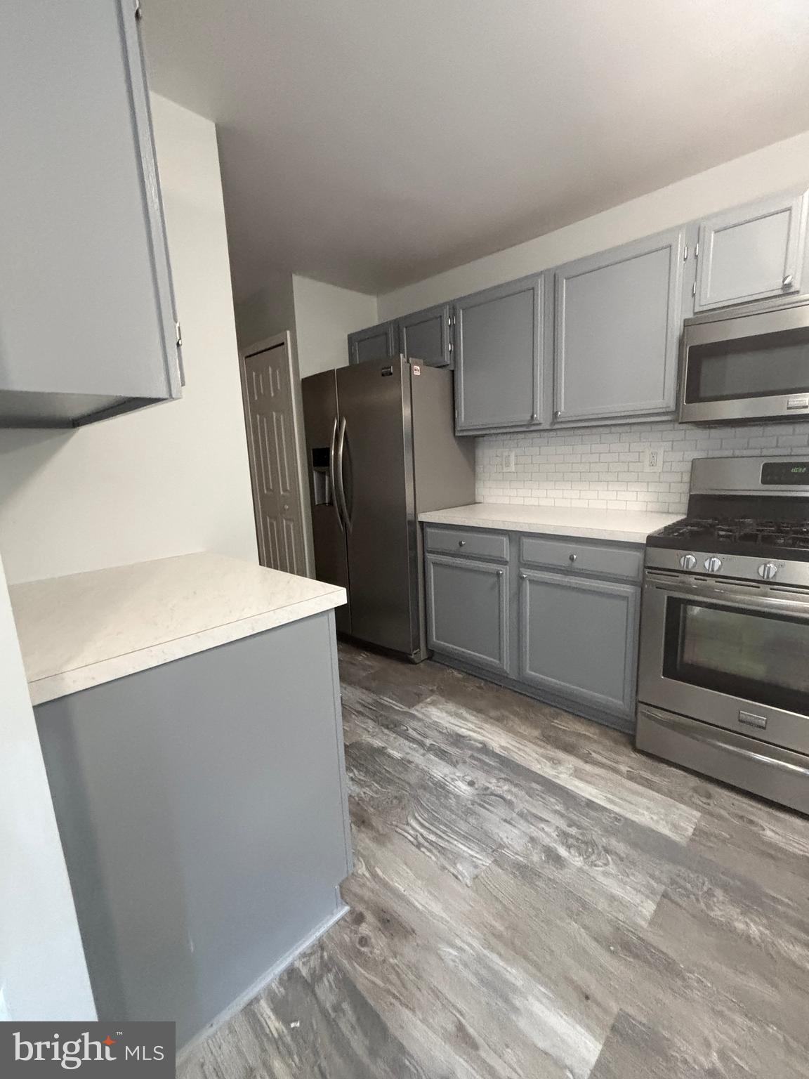 307 Tall Pines Court, Unit 3 Abingdon, MD 21009 - Photo 19 of 52 a kitchen with stainless steel appliances a refrigerator and a stove