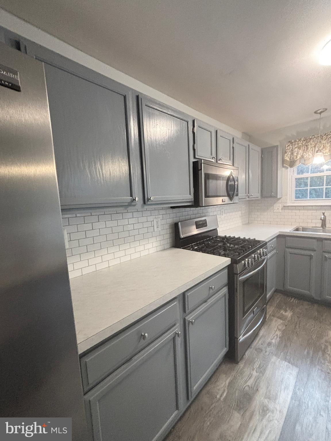 307 Tall Pines Court, Unit 3 Abingdon, MD 21009 - Photo 23 of 52 a kitchen with a refrigerator sink and cabinets