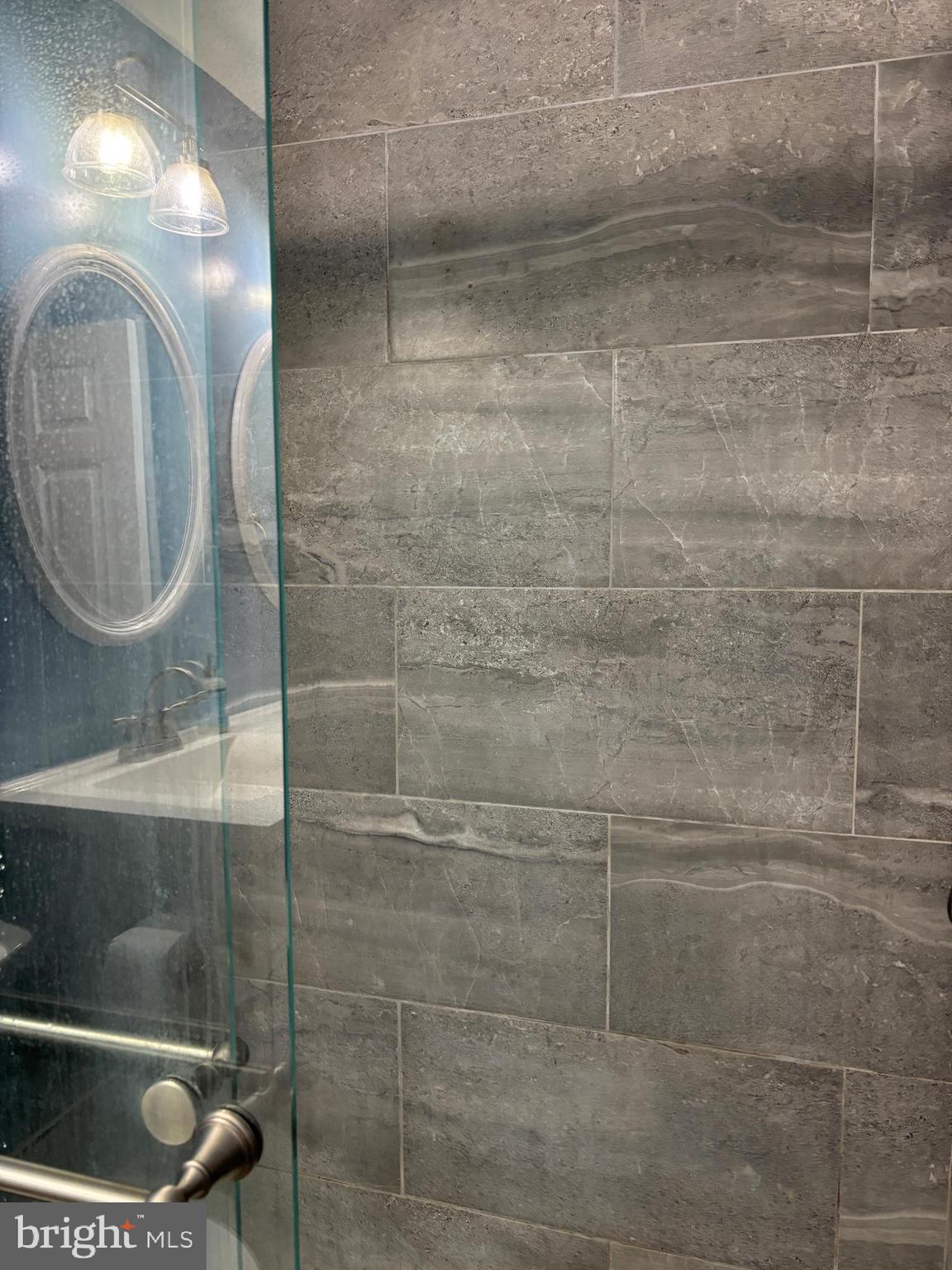 307 Tall Pines Court, Unit 3 Abingdon, MD 21009 - Photo 29 of 52 a bathroom with a light fixture and a sink