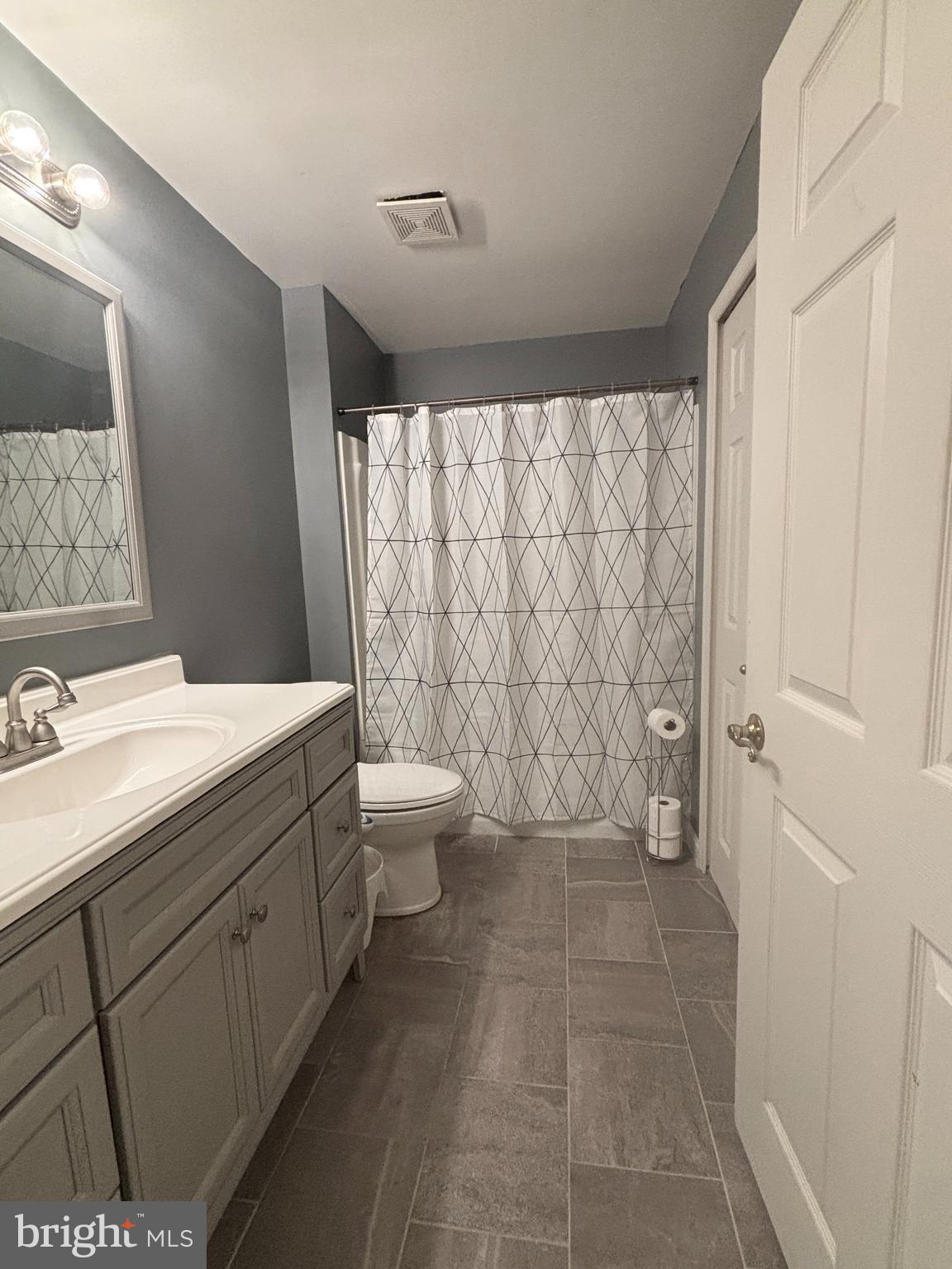 307 Tall Pines Court, Unit 3 Abingdon, MD 21009 - Photo 41 of 52 a bathroom with a sink a toilet and shower