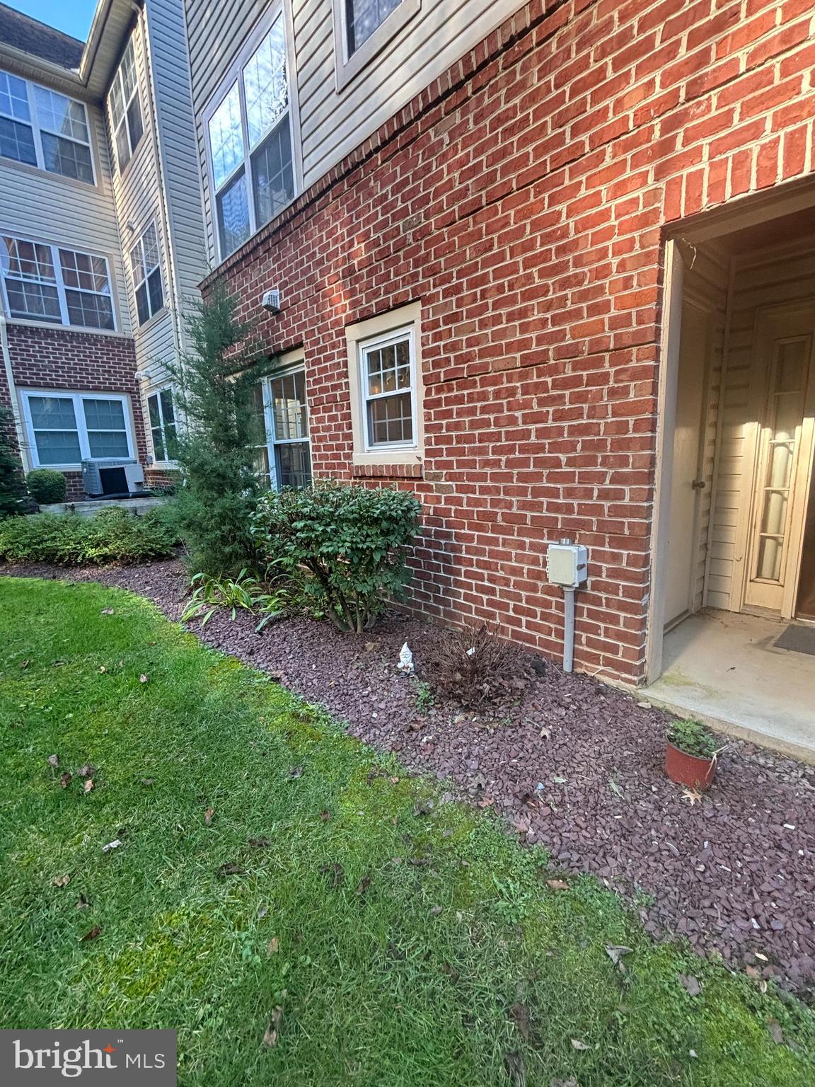 307 Tall Pines Court, Unit 3 Abingdon, MD 21009 - Photo 50 of 52 a view of a brick house with a yard