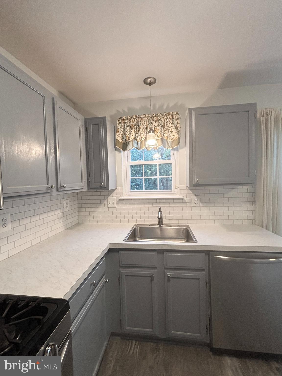 307 Tall Pines Court, Unit 3 Abingdon, MD 21009 - Photo 10 of 52 a kitchen with sink cabinets and window