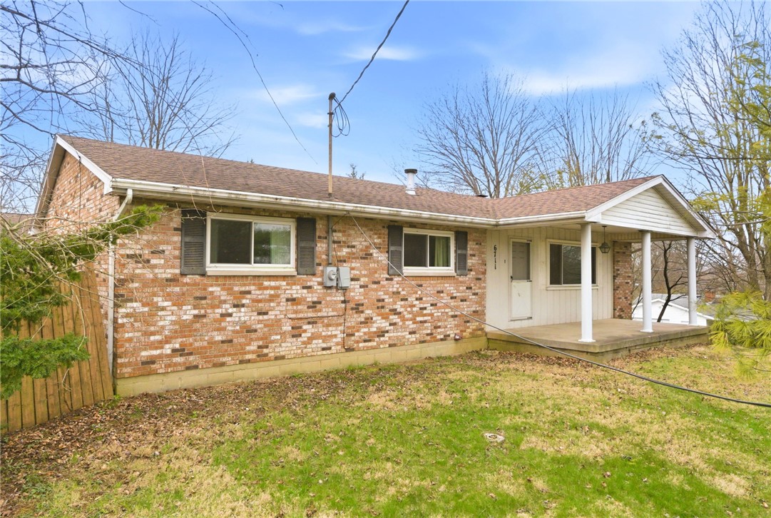 6711 Hamilton-Middletown Road Franklin, OH 45005 - Photo 2 of 49 This classic brick residence features a welcoming covered porch, perfect for enjoying outdoor moments.