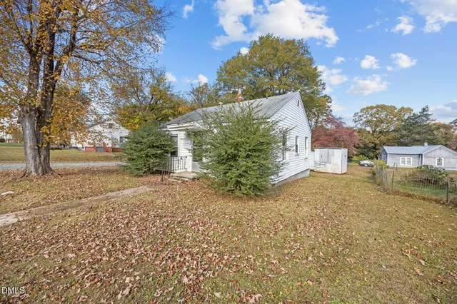 a view of a yard and front view of a house
