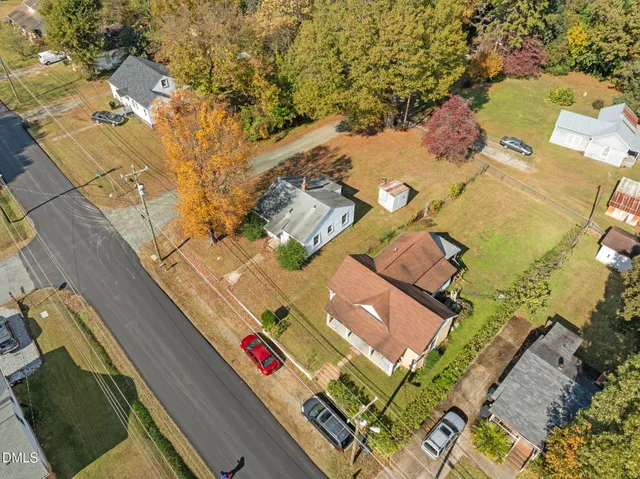 an aerial view of a house with a yard