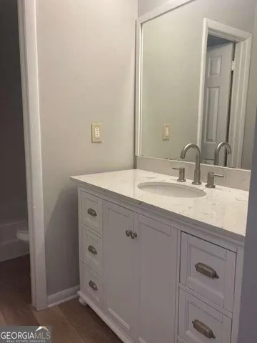 a bathroom with a sink and a mirror
