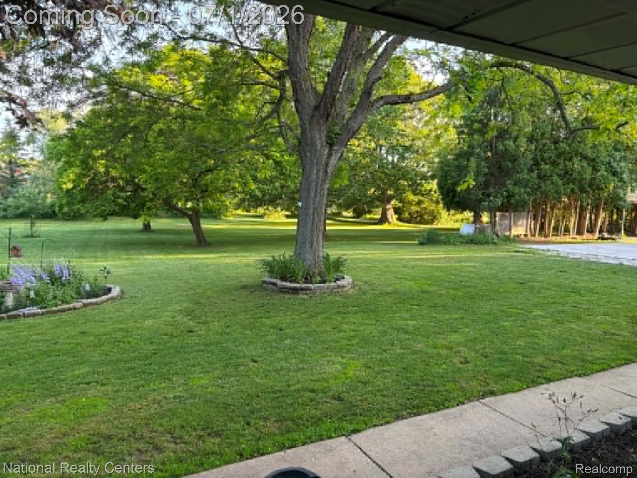 1330 Brauer Road Oxford, MI 48371 - Photo 11 of 54 Expansive green lawn with mature trees and established landscaping