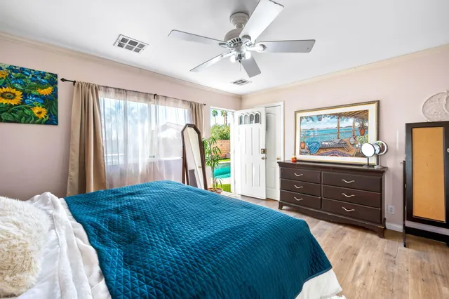 a bedroom with a bed and a dresser