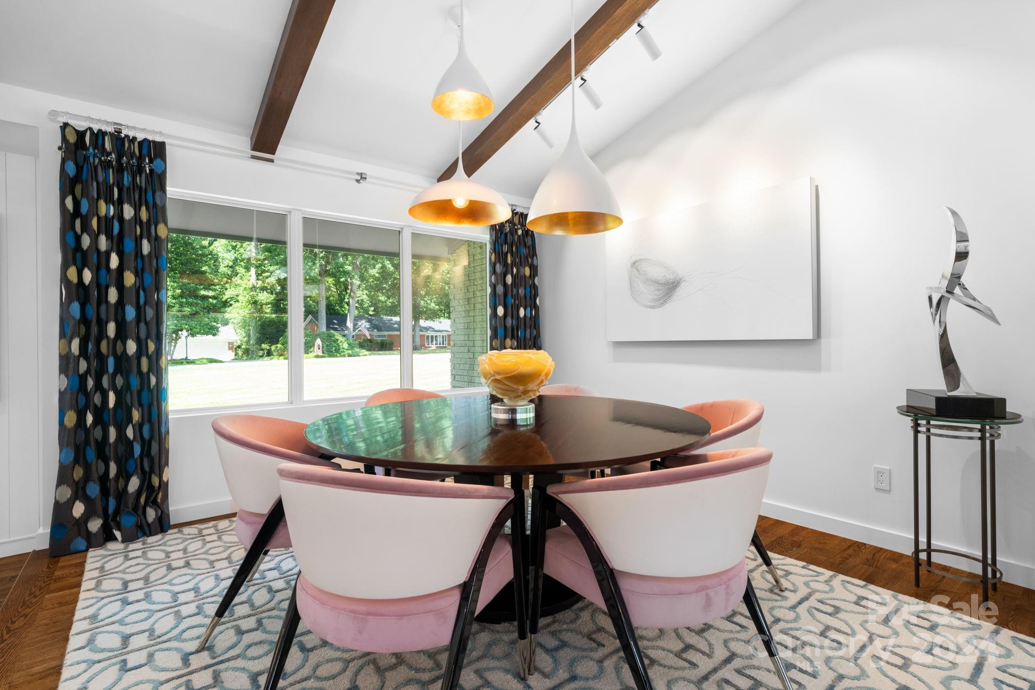 4142 Oldfield Road Charlotte, NC 28226 - Photo 11 of 48 a dining room with furniture and wooden floor