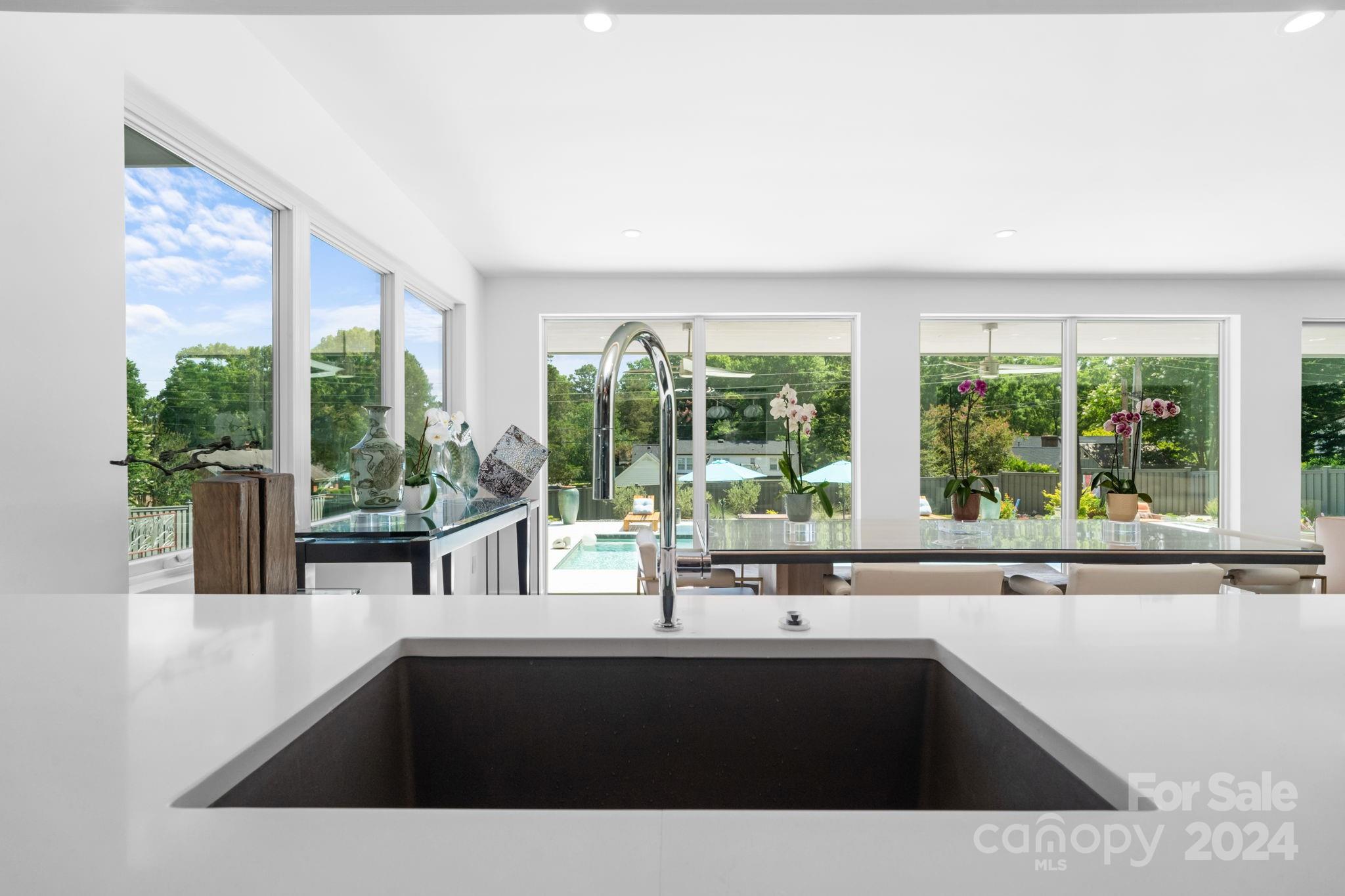 4142 Oldfield Road Charlotte, NC 28226 - Photo 15 of 48 a kitchen with a sink and large window