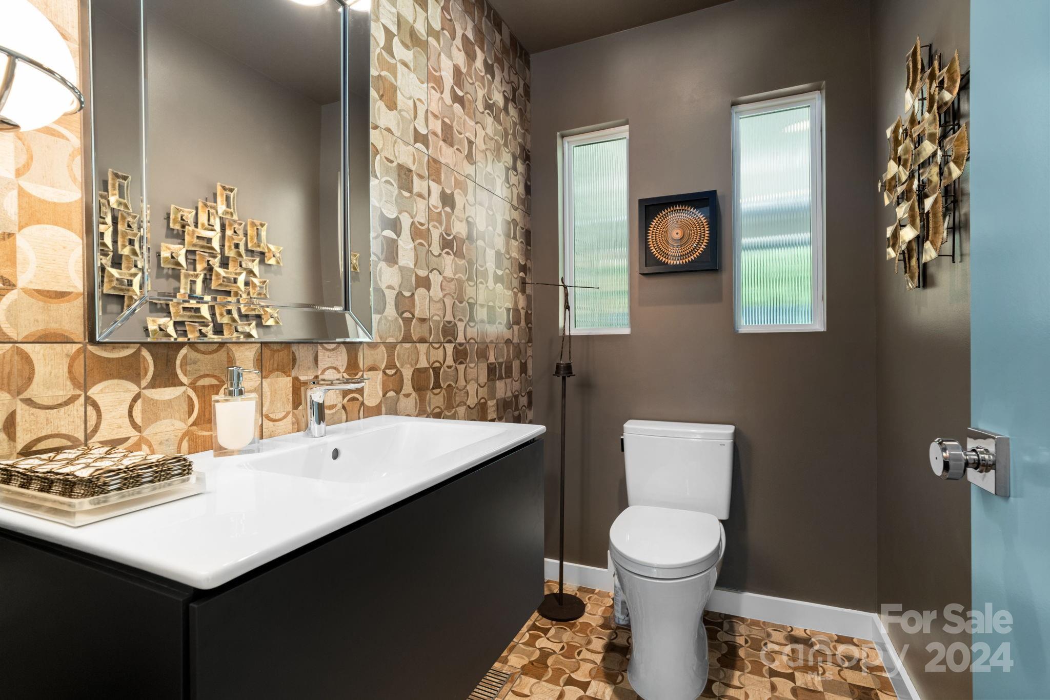 4142 Oldfield Road Charlotte, NC 28226 - Photo 25 of 48 a bathroom with a sink a toilet and a shower