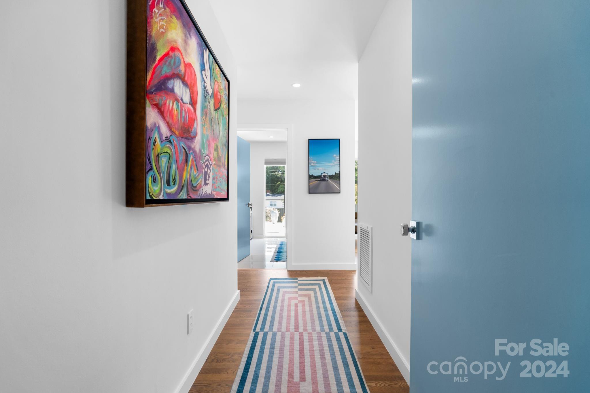 4142 Oldfield Road Charlotte, NC 28226 - Photo 26 of 48 a view of a hallway with wooden floor and furniture