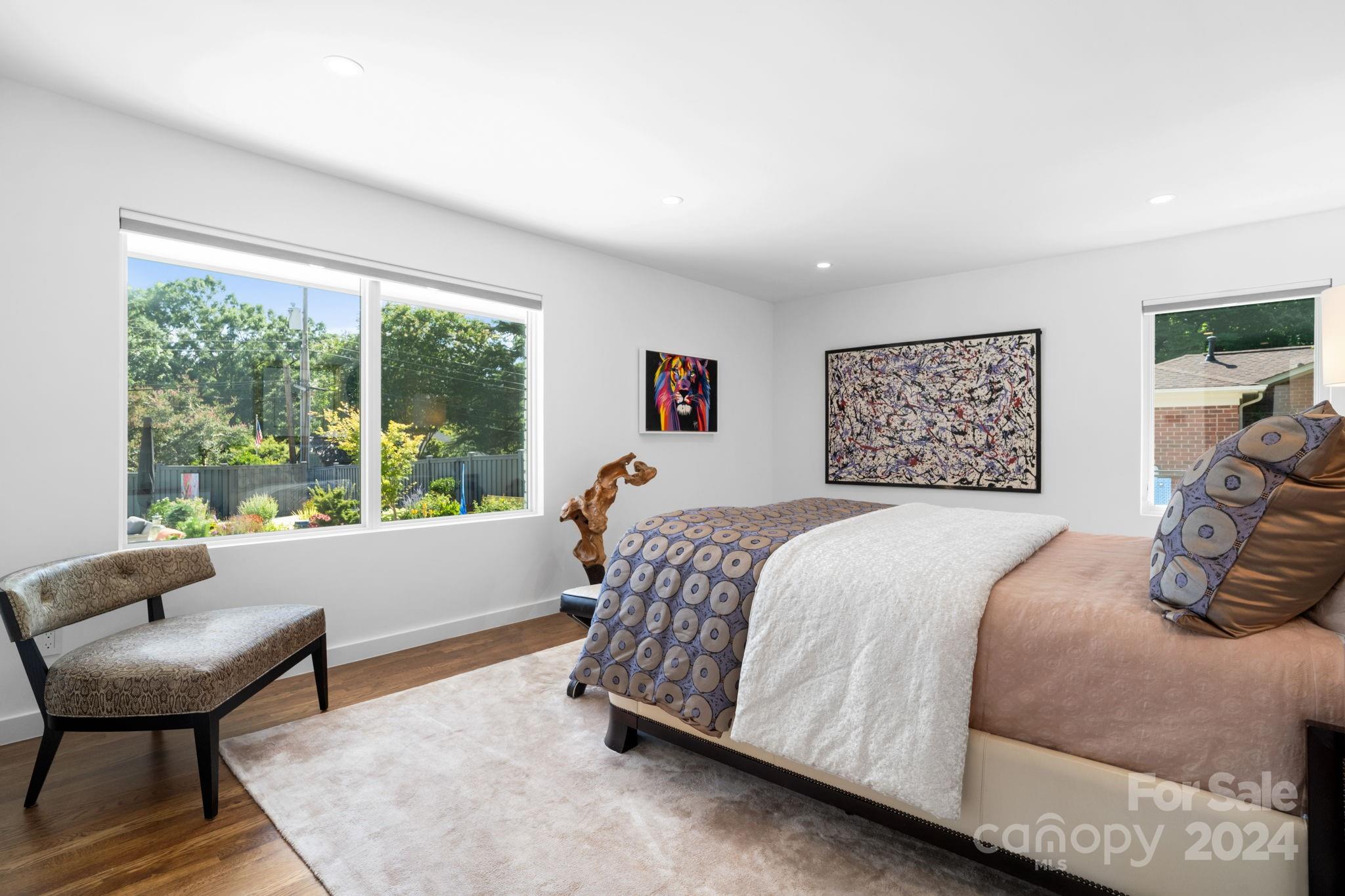 4142 Oldfield Road Charlotte, NC 28226 - Photo 27 of 48 a bedroom with a bed and a large window