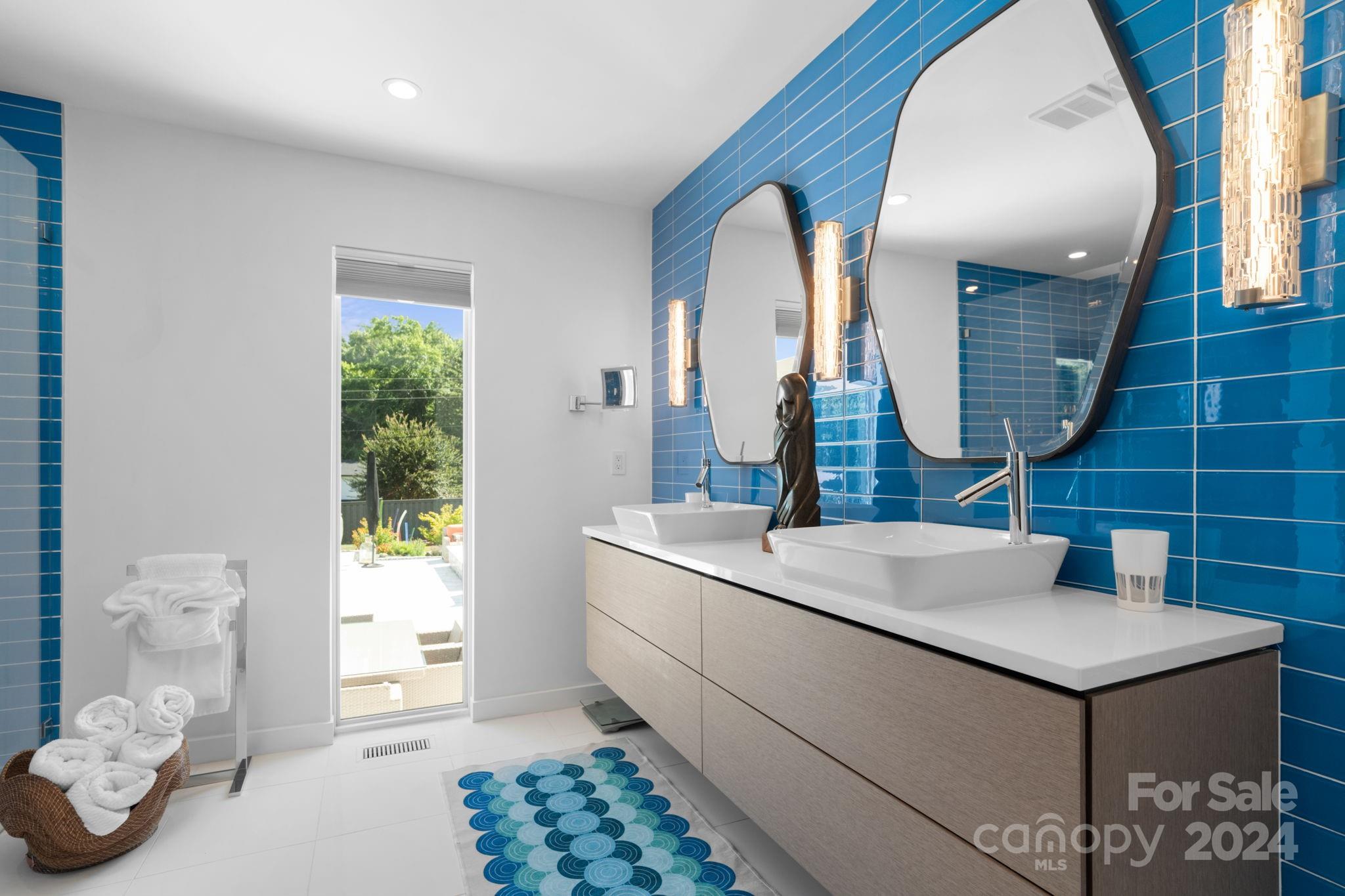 4142 Oldfield Road Charlotte, NC 28226 - Photo 29 of 48 a bathroom with a sink and a mirror
