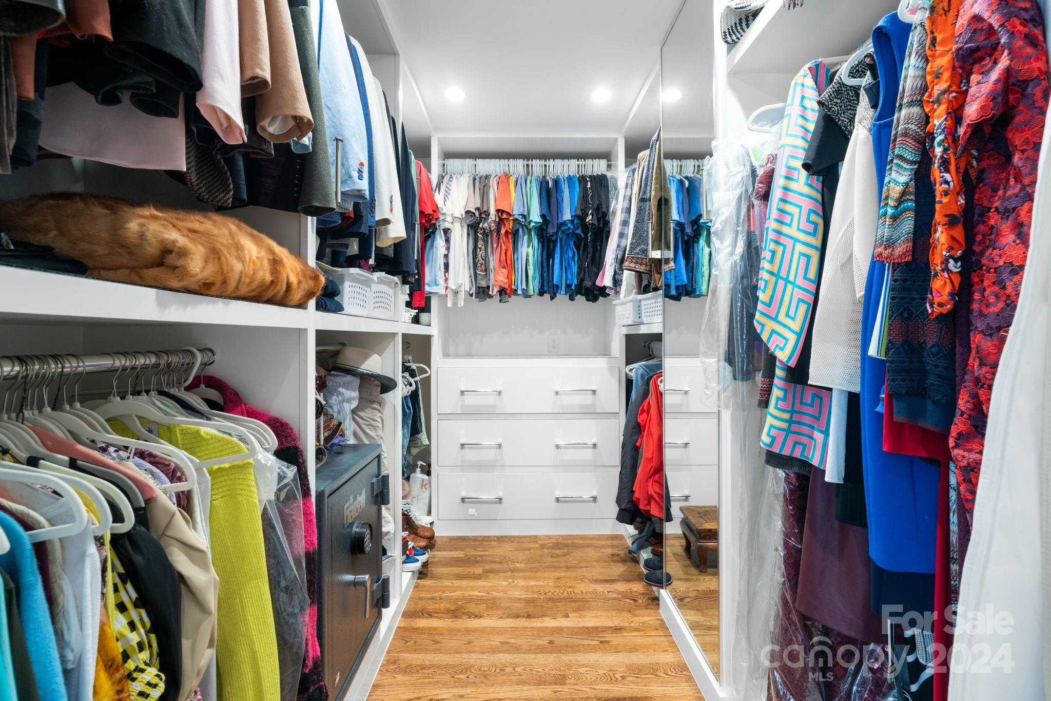 4142 Oldfield Road Charlotte, NC 28226 - Photo 32 of 48 a view of walk in closet with clothes and shoes