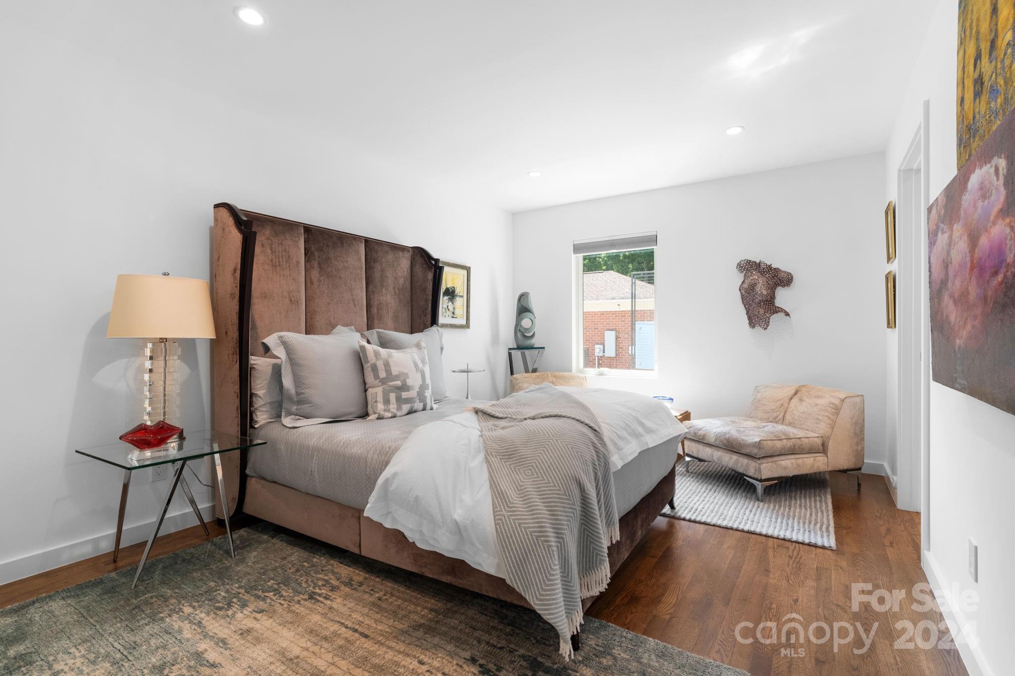 4142 Oldfield Road Charlotte, NC 28226 - Photo 37 of 48 a bedroom with a bed and a window