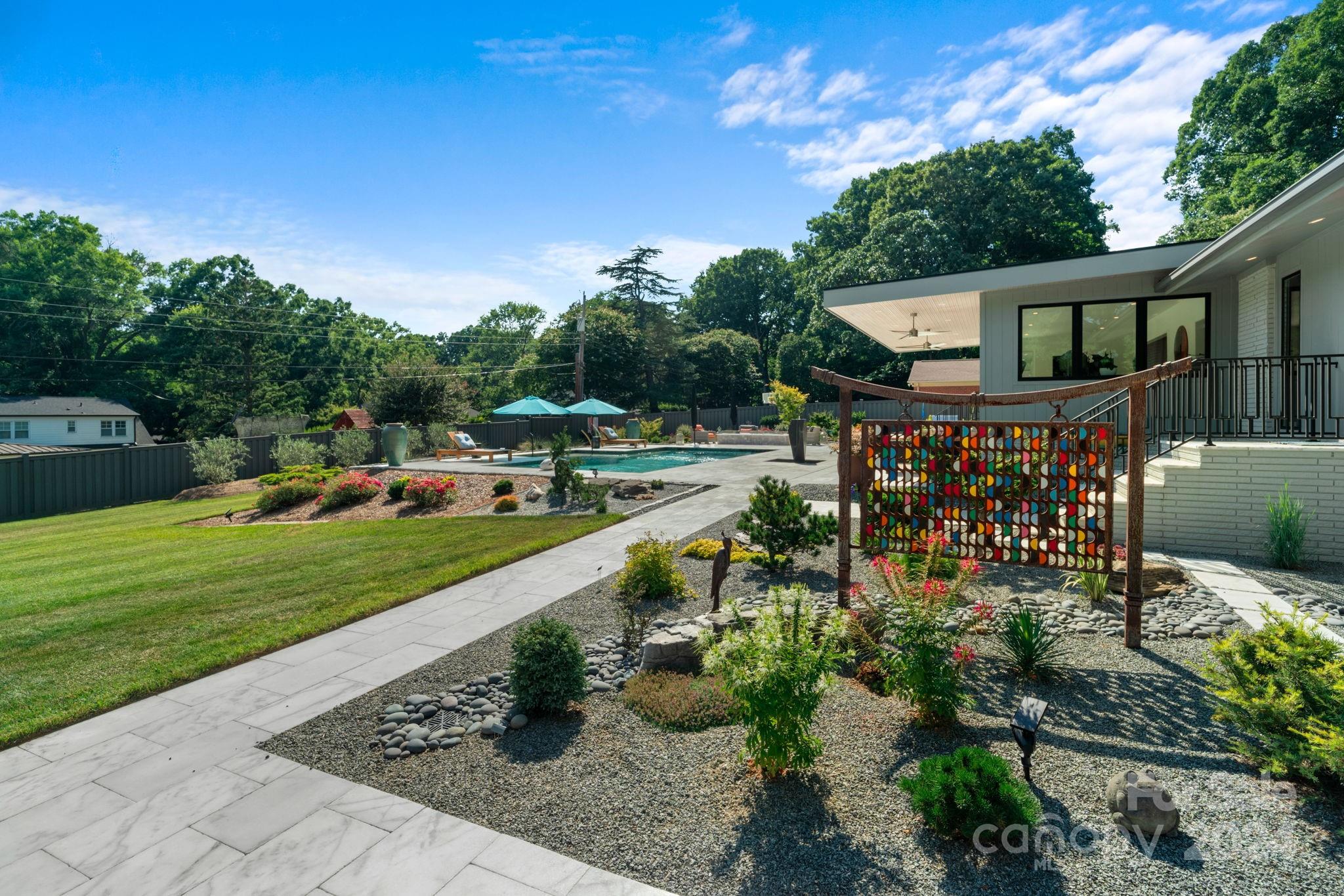 4142 Oldfield Road Charlotte, NC 28226 - Photo 46 of 48 a view of a garden with patio
