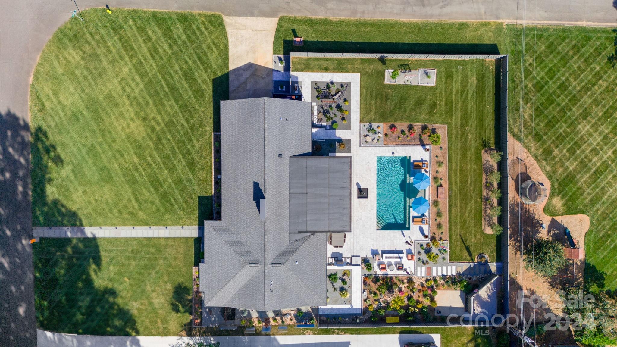 4142 Oldfield Road Charlotte, NC 28226 - Photo 48 of 48 an aerial view of a house with a yard swimming pool and outdoor seating