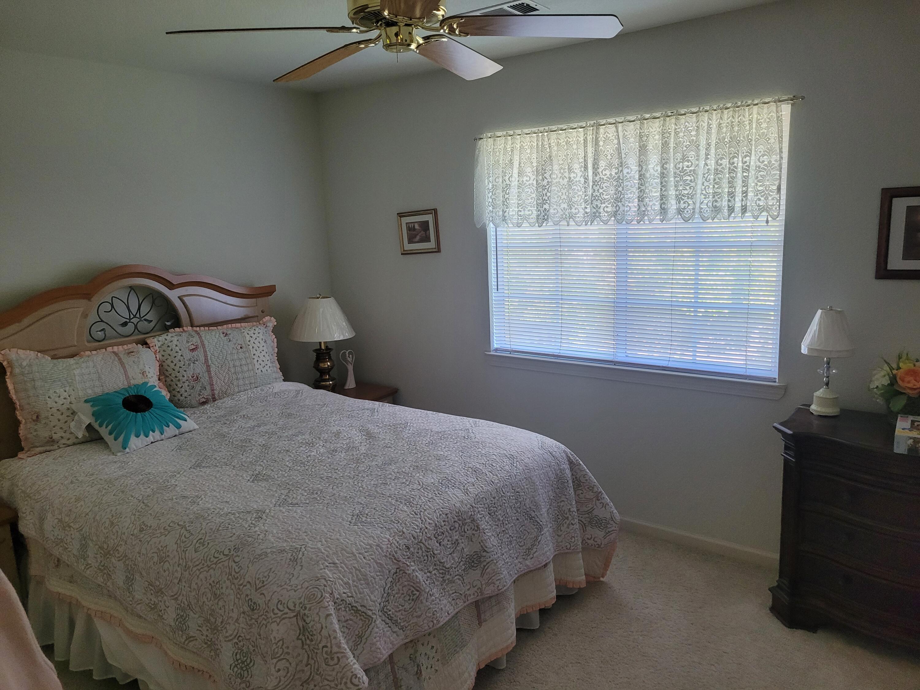 4979 Tralee Lane Redding, CA 96001 - Photo 12 of 19 a bedroom with a bed and window