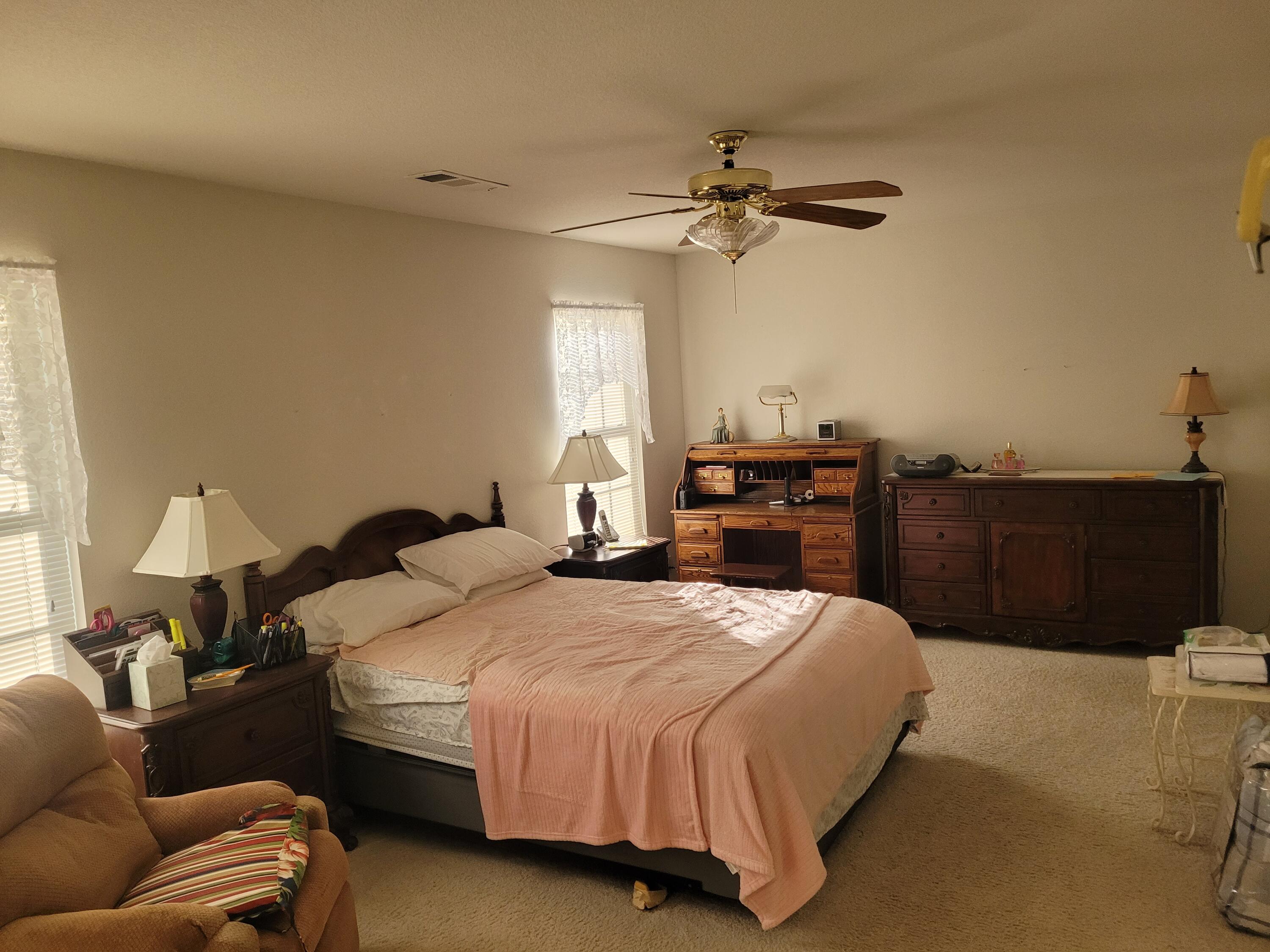 4979 Tralee Lane Redding, CA 96001 - Photo 14 of 19 a bedroom with a bed and dresser