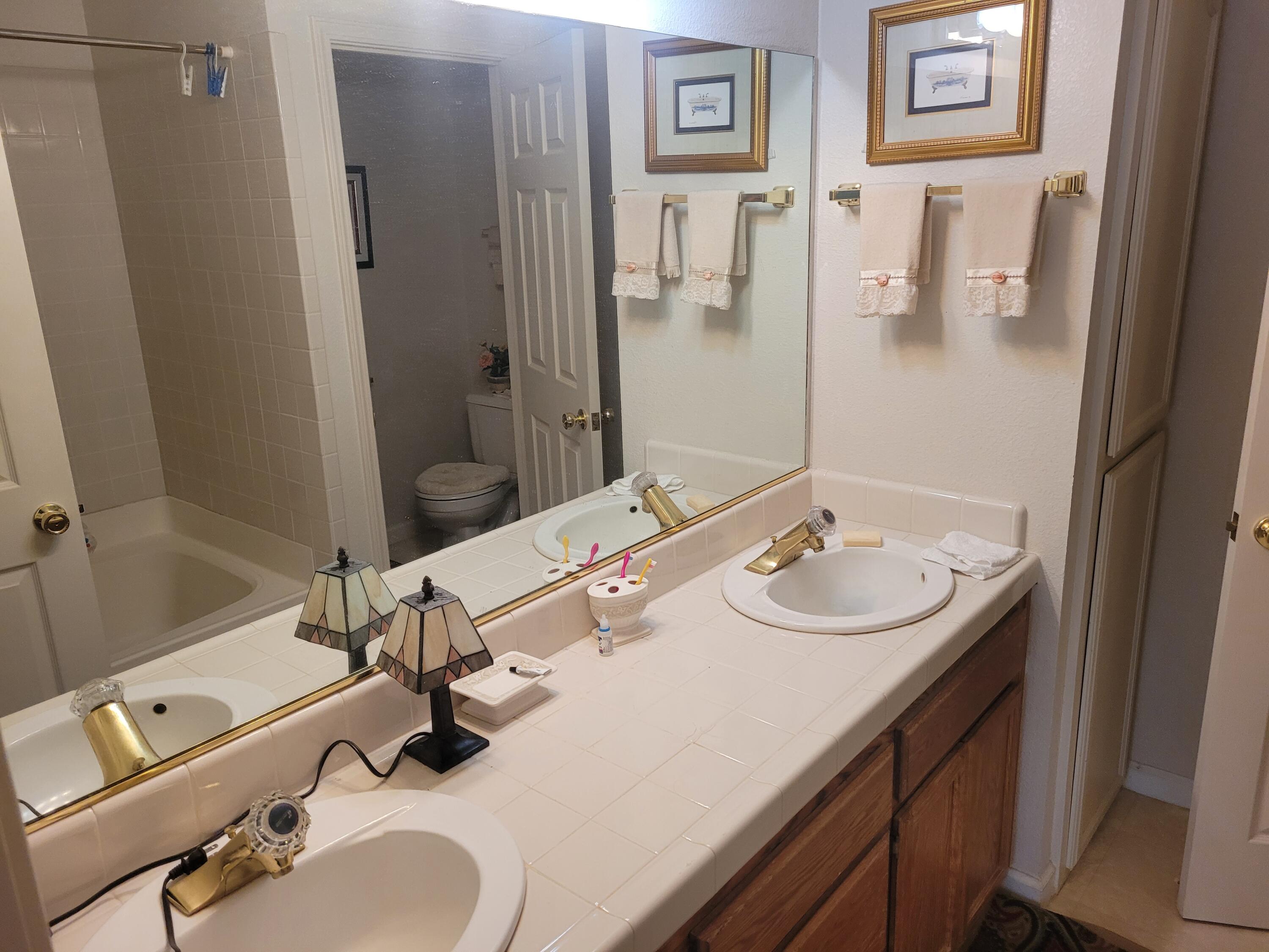 4979 Tralee Lane Redding, CA 96001 - Photo 15 of 19 a bathroom with a sink and a mirror