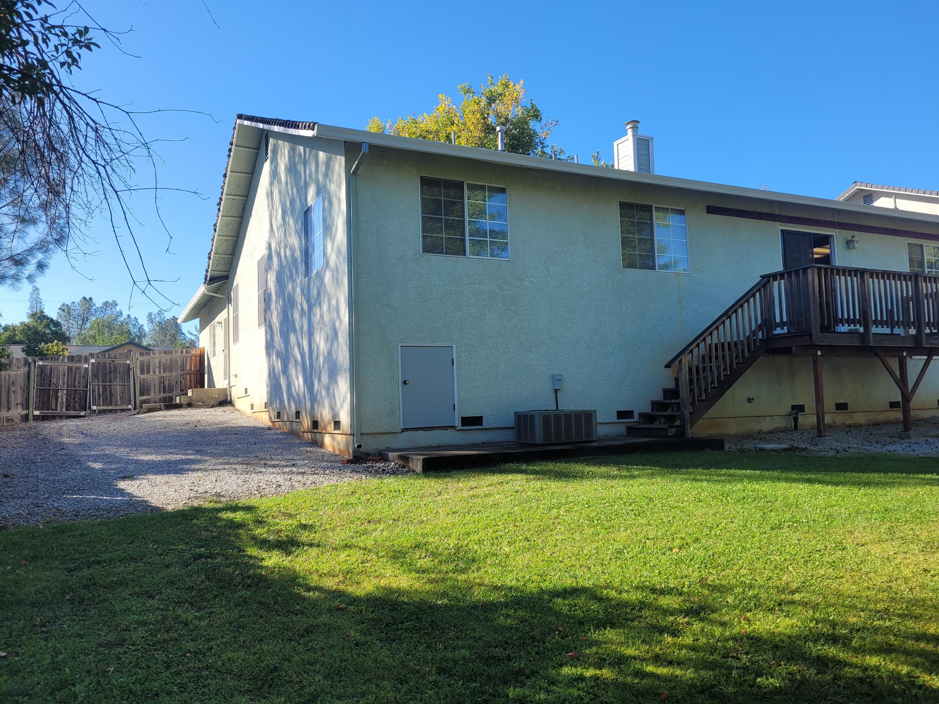 4979 Tralee Lane Redding, CA 96001 - Photo 18 of 19 a view of a house with backyard