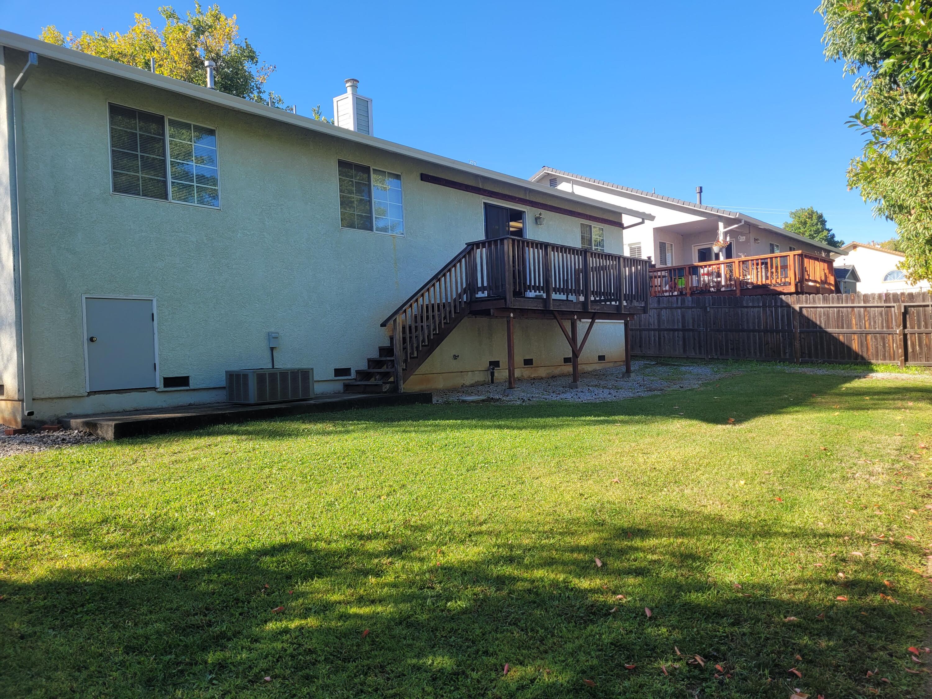 4979 Tralee Lane Redding, CA 96001 - Photo 19 of 19 a view of a house with a swimming pool