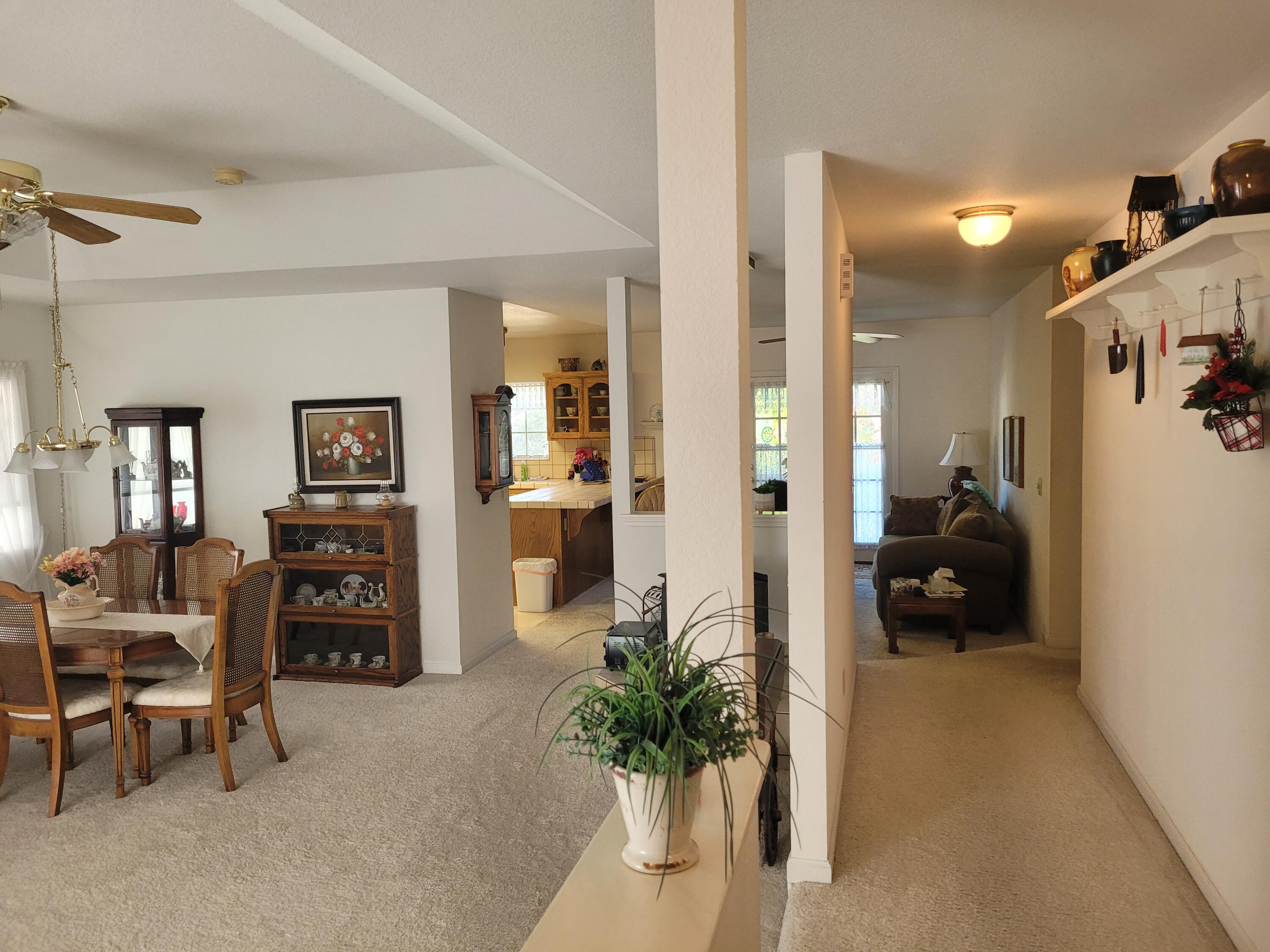 4979 Tralee Lane Redding, CA 96001 - Photo 3 of 19 a living room with furniture and a flat screen tv