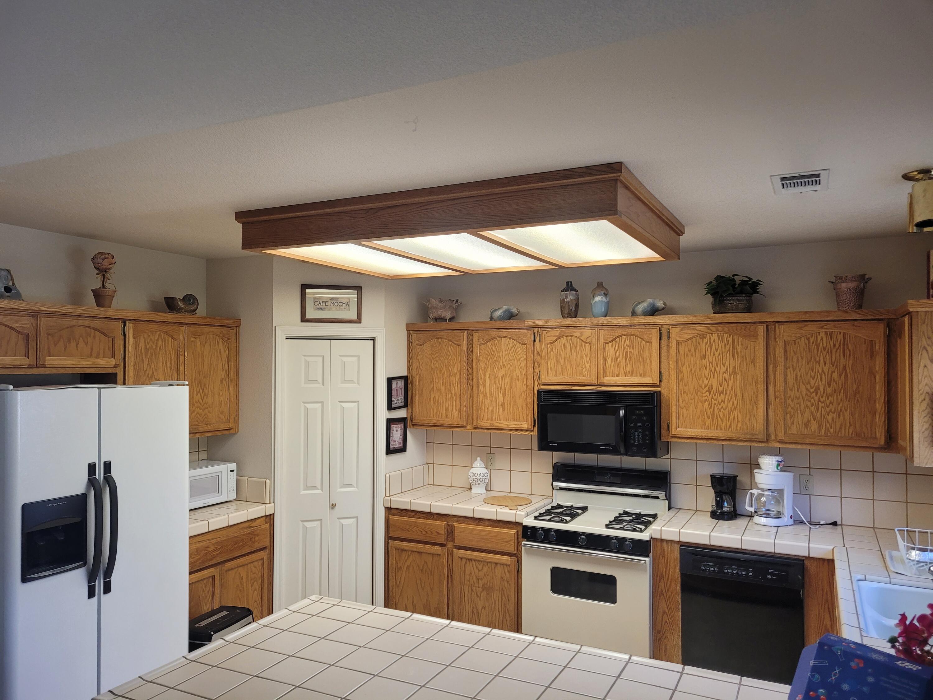 4979 Tralee Lane Redding, CA 96001 - Photo 10 of 19 a kitchen with cabinets and steel stainless steel appliances