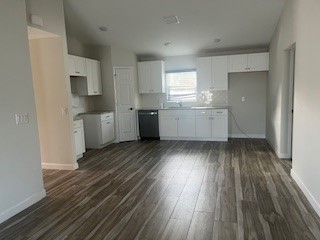 1625 2nd Avenue Southwest Vero Beach, FL 32962 - Photo 3 of 17 a room with a wooden floors and white walls