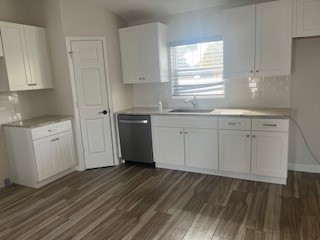 1625 2nd Avenue Southwest Vero Beach, FL 32962 - Photo 4 of 17 a kitchen with granite countertop a sink cabinets stainless steel appliances and a window
