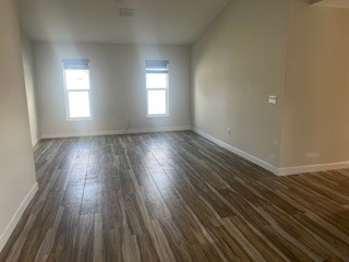 1625 2nd Avenue Southwest Vero Beach, FL 32962 - Photo 5 of 17 an empty room with wooden floor and windows