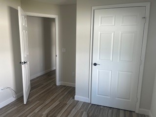 1625 2nd Avenue Southwest Vero Beach, FL 32962 - Photo 8 of 17 a view of a hallway with wooden floor and staircase