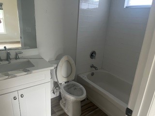 1625 2nd Avenue Southwest Vero Beach, FL 32962 - Photo 10 of 17 a bathroom with a granite countertop toilet sink and bathtub