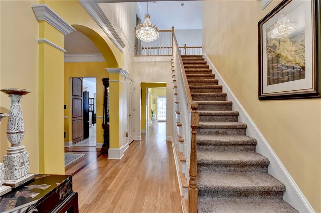 1031 Riverside Road Sugar Hill, GA 30518 - Photo 15 of 109 a view of a hallway with wooden floor and staircase