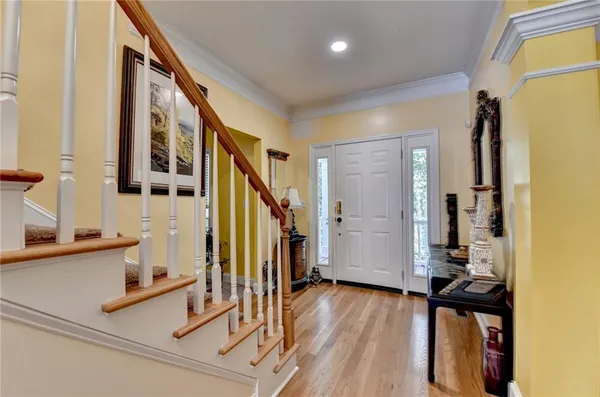 a view of a dining room with furniture and chandelier
