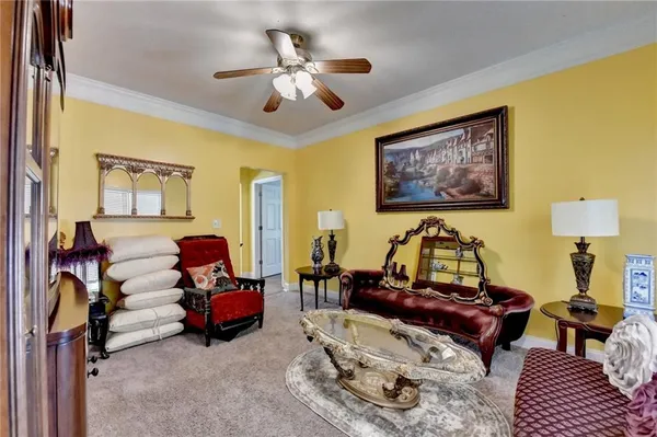 a view of a dining room with furniture and chandelier
