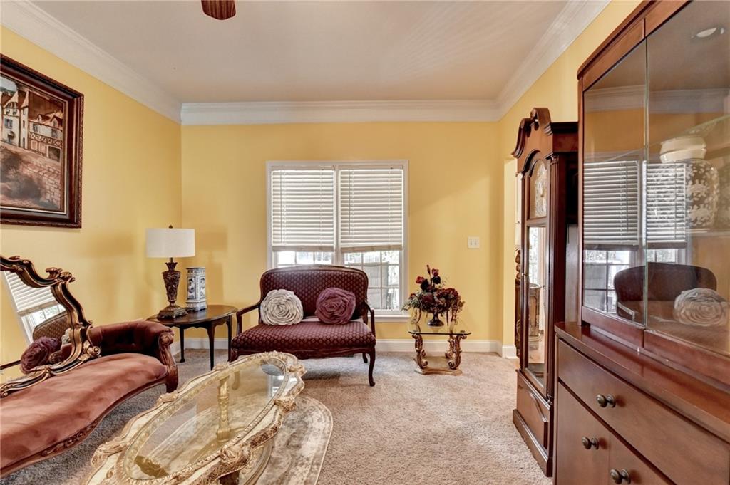 1031 Riverside Road Sugar Hill, GA 30518 - Photo 19 of 109 a living room with furniture and a window