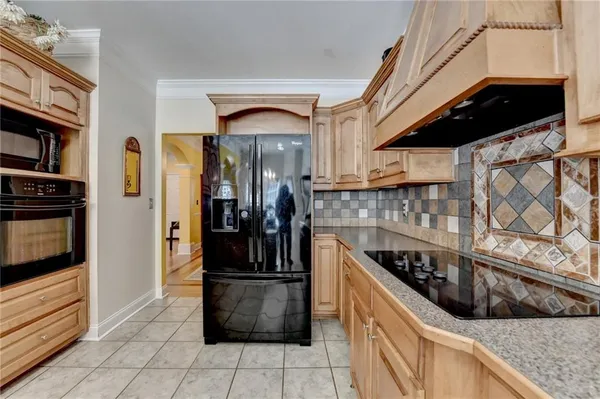 a bedroom with a large bed and cabinets