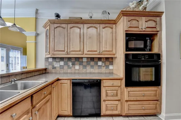 a bathroom with a sink a mirror and a shower